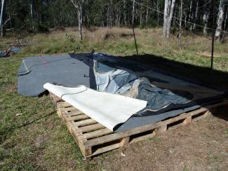 Pallet floor with carpet insulation ready to put up tent