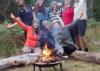 Volunteer group by the campfire